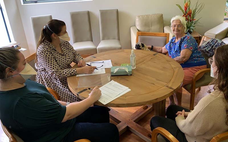 Eden Alternative Philosophy of Care in action: resident helping during staff interviews at Anam Cara Aged Care community