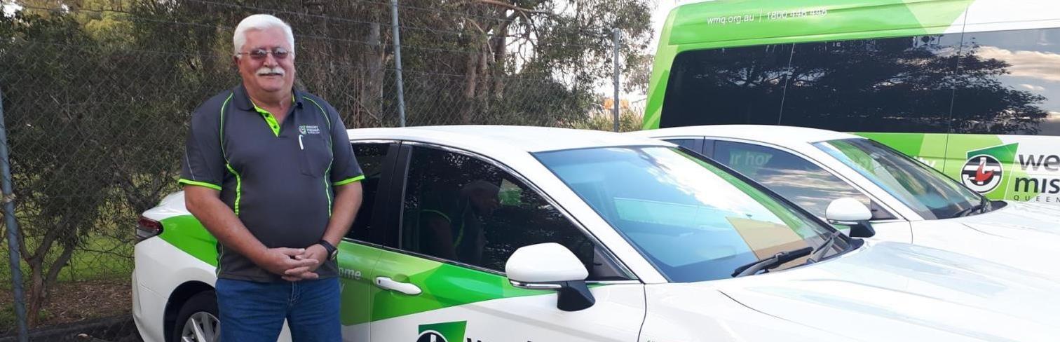 Man standing in front of transport