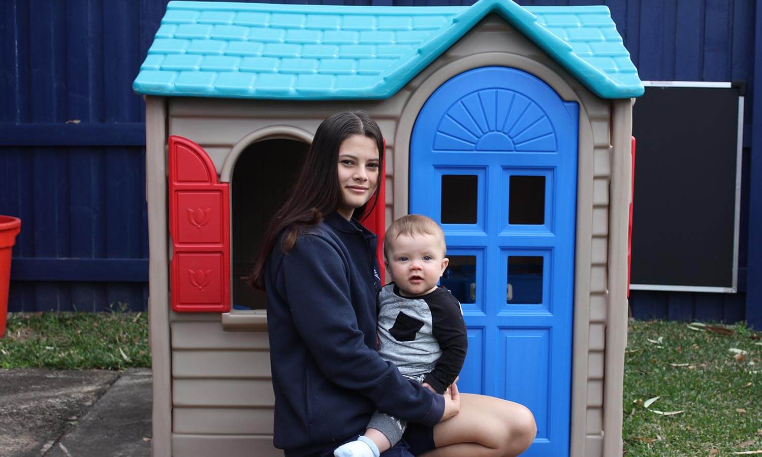 young woman holding baby