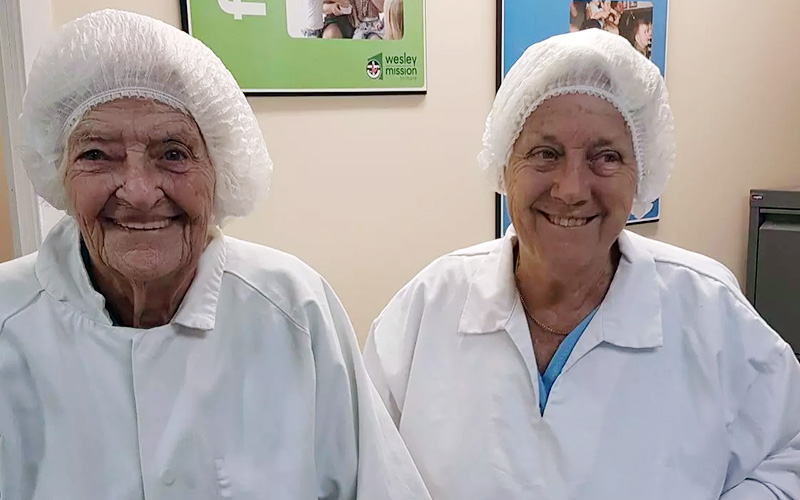 Residents from Anam Cara Aged Care smiling during a visit yo WMQ Dining Services kitchen